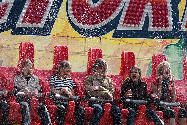 Laren, The Netherlands - May, 19 2007: Children in an amusement ride on a fair are screaming of joy and fear when they are splashed with water.