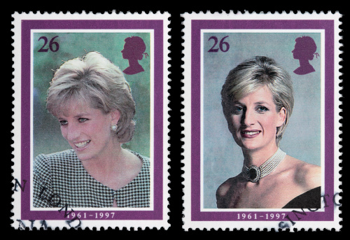 Sacramento, California, USA - April 12, 2008:  Two 1998 Great Britain postage stamps designed by Barry Robinson with portraits of Princess Diana, part of a series of five such stamps issued to commemorate her life. The portrait with Diana wearing a black dress was taken by photographer Lord Snowdon in May 1997; the one where she is wearing a checkered top was taken by Tim Graham in October 1995.