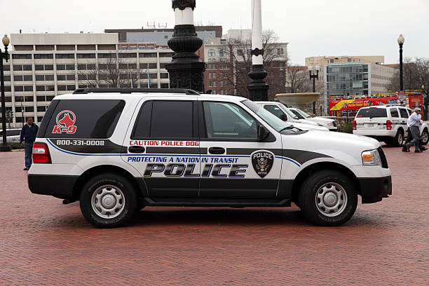 Amtrak Police Vehicle Washington D.C., USA - March 18, 2011: Amtrak SUV K-9 unit with several other vehicles in background sitting outside Union Station in Washington D.C. Amtrak police are responsible for security at Amtrak train stations. Amtrak stock pictures, royalty-free photos & images