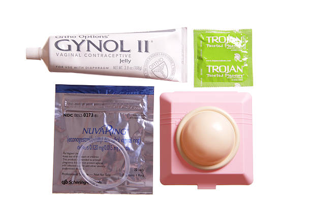 Birth Control Choices DeKalb, Illinois, USA - February, 7 2011: Ortho Diaphragm, Gynol II spermicide Gel, Nuva Ring, and Trojan Condom. Isolated on White. diaphragm contraceptive stock pictures, royalty-free photos & images