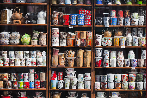 Warsaw, Poland - April 3, 2011: Coffe mugs and tea cups in shop window. Seen in Marszalkowska Street, Warsaw, Poland. Marszalkowska (Marshal Street) is one of the main thoroughfares of Warsaw's city center. It links Bank Square in its north sector with Plac Unii Lubelskiej (Union of Lublin Square) in the south.