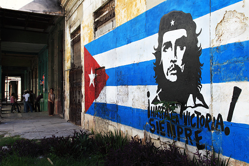 Habana, Cuba – September 7, 2011: Image of Che Guevara painted in a political sign in Old Habana exalting the revolution that happened more than 50 years ago.