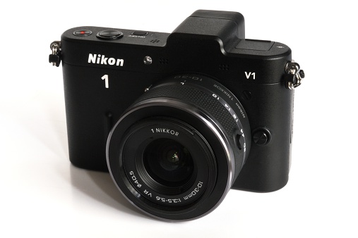 Kampen, The Netherlands - January 26, 2012: Nikon V1 mirrorless digital camera with interchangeable lens isolated in a studio.