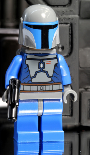 Vancouver, Canada - August 1, 2012: A toy Lego Jango Fett from the Star Wars film franchise, posed against a black background.
