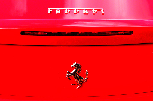 Apeldoorn, The Netherlands - August 30, 2011: Ferrari logo on the back of a red Ferrari 360 Modena sports car.