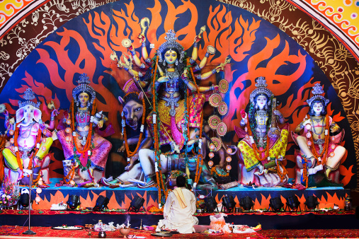 Chittaranjan Park, Delhi, India - October 12, 2013Event : Durga Puja Festival in Delhi.The Head priest performs Ashtami puja (worship) on 12-Oct-2013, at Chittaranjan Park, Delhi, India.Ashtami puja is the climax of the 5-day Durga Puja Festival. Devotees make it a point to attend this puja come what may.The deity is immersed in water after the 5-day festival is concluded.