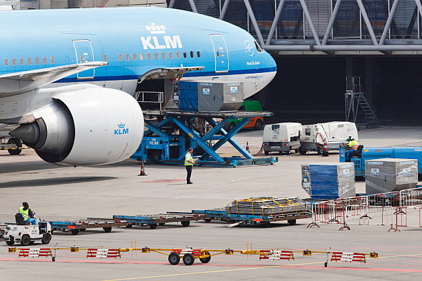 KLM plane being serviced at Schiphol Airport stock photo
