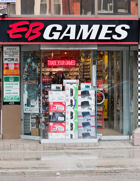 EB Games Toronto, Canada - March 10, 2011: The exterior of the EB Games retail store on Queen Street West in Toronto.  EB Games is a computer and video game retailer owned by GameStop. computer store stock pictures, royalty-free photos & images