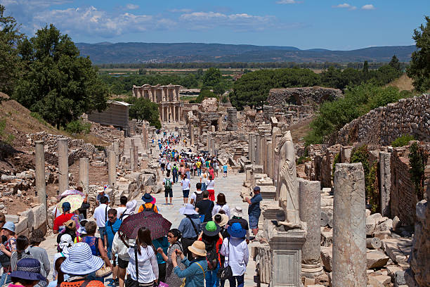 Unidentified tourists visiting greek-roman ruins Ephesus stock photo