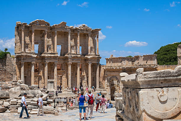 Unidentified tourists visit greek-roman ruins of Ephesus stock photo