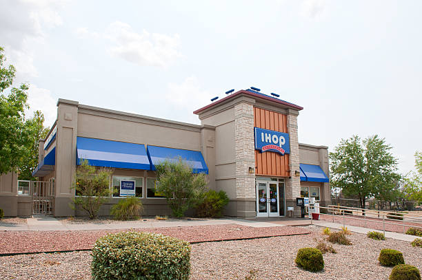 International House of Pancakes - IHOP Restaurant Albuqerque, New Mexico, USA - July 2, 2011: Side view of the IHOP Restaurant in North East Albuquerque. The International House of Pancakes, also known as IHOP is a United States-based restaurant chain that specializes in breakfast foods such as pancakes, French toast and omelettes. Ihop stock pictures, royalty-free photos & images