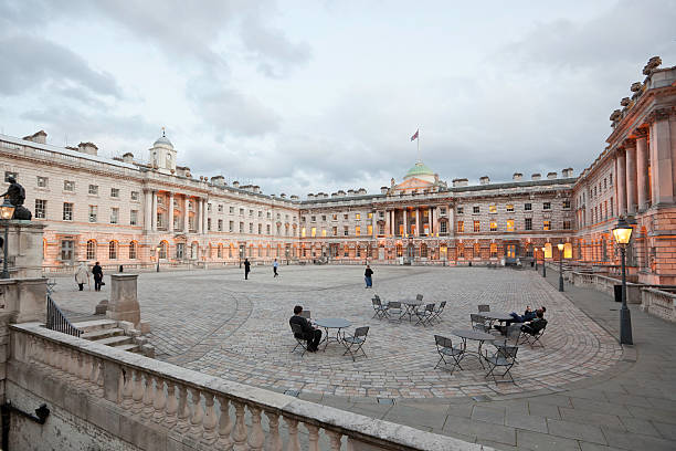 Somerset house London, UK - October 17, 2011: Somerset House and courtyard in the evening. A few people are relaxing at the tables, while visitors to Somerset House are walking by on the courtyard. university of london photos stock pictures, royalty-free photos & images