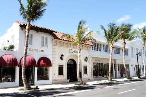 Palm Beach, Florida, USA - May 1, 2011: This is a view of  Worth Avenue in Palm Beach Florida. Several high end designer goods retail stores line this section of the street, including Cartier, Rangoni and MaxMara. Worth Avenue is the trendy shopping area for designer goods and fashion accessories in Palm Beach, Florida.