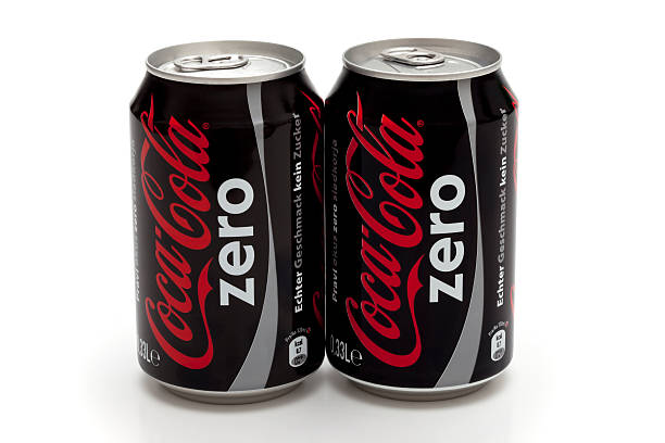 Coca Cola Zero Trebnje, Slovenia - May 30: Two cans of 0,33l Coca Cola Zero, studio shot against a white background with shadow. coke zero photos stock pictures, royalty-free photos & images