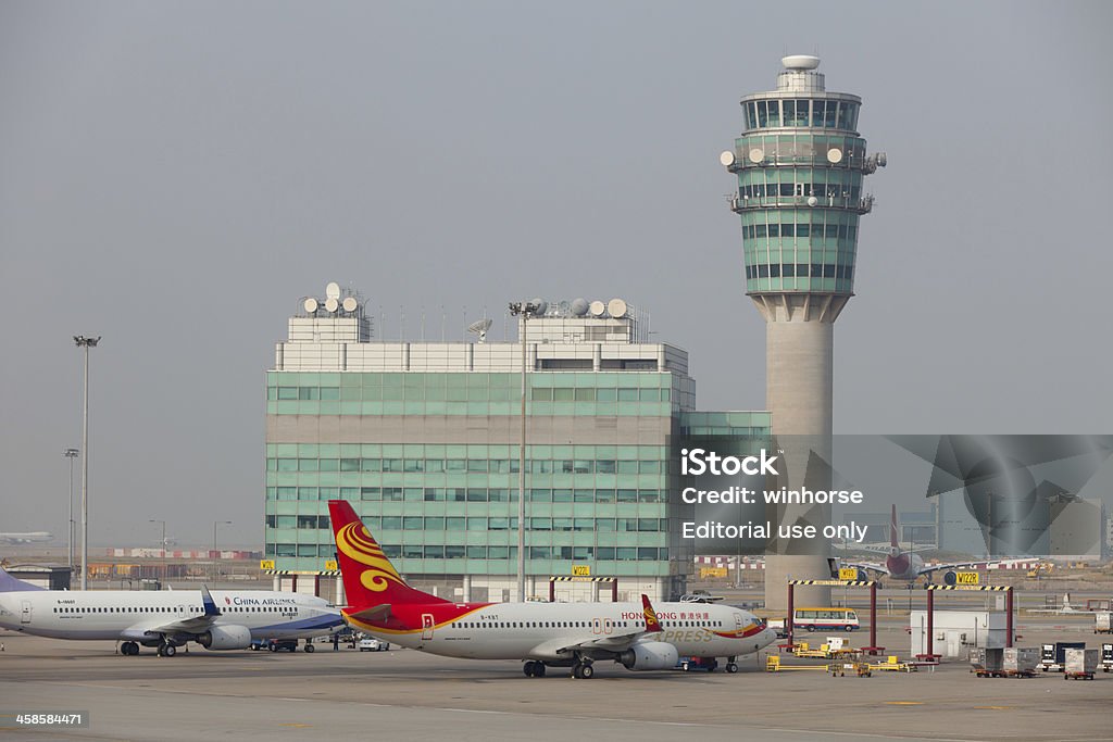 Hong Kong International Airport Hong Kong, China - September 28, 2011 : China Airlines and Hong Kong Express\'s airplanes parked at Hong Kong International Airport. Hong Kong Airport Authority said it had to find ways to increase the capacity of the airport because current facilities were expected to be saturated. A proposed third runway would enable the airport to increase the capacity. Airport Stock Photo