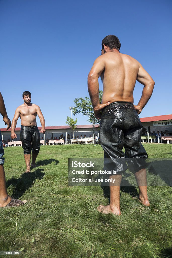 Annual meeting of Pomaks in Greece Hilia Evros, Greece - August 18, 2013: Unidentified wrestlers at the annual meeting of the Pomaks in Hilia location of all the villages in the area in Hilia Evros, Greece. Pomaks are a breed indigenous Adult Stock Photo