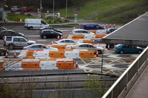 Bristol, England - March 24, 2011: Toll booth plaza on the Westbound Severn Bridge. Cars and vans queuing to cross from England into Wales on the M48