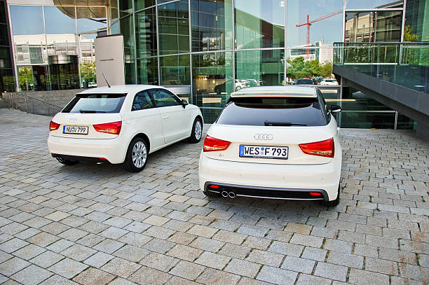 Two Audi A1 Ingolstadt, Germany - July 12, 2011: Two brand new Audi A1 parked right outside the famous Audi Museum at Ingolstadt. The Audi A1 (internally designated Typ 8X) is a supermini-class car launched at the 2010 Geneva Motor Show. ingolstadt photos stock pictures, royalty-free photos & images