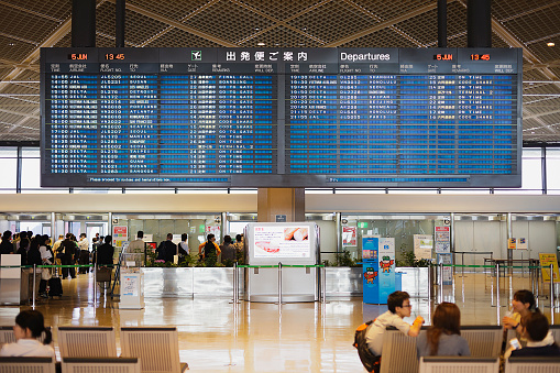Narita, Japan - June 5, 2011: The main departure board in terminal one at Narita International Airport, an airport serving the greater Tokyo area of Japan. Narita handles the majority of international passenger traffic to and from Japan, and is also a major connecting point for air traffic between Asia and the Americas.
