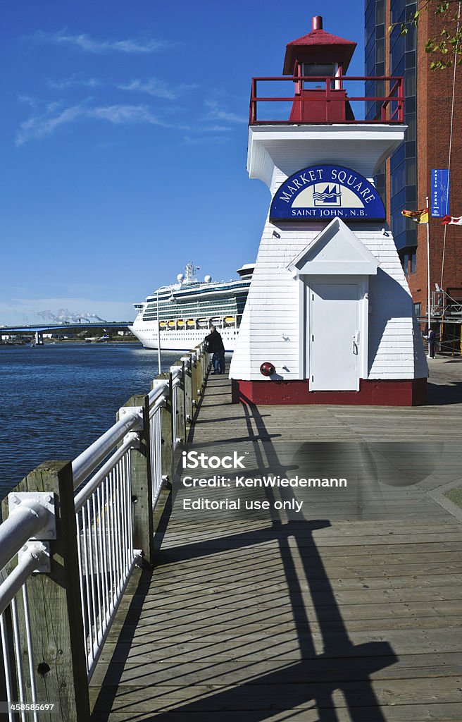 Market Square Lighthouse Saint John, New Brunswich, Canada-September 21, 2010:A small lighthouse on the dock advertises the large shopping area of Market Square in downtown St. John.  Royal caribbean International cruise ship Jewel of the Seas is docked in the background. Architectural Feature Stock Photo