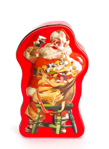 Chatham, Ontario, Canada - July 22, 2011: Coca-Cola Collectable Tin Box With Vintage santa Advertisement. One of many Coca-Cola products manufactured for the retail industry for collectors of Coca-Cola memorabilia. Coca-Cola, commonly referred to as 