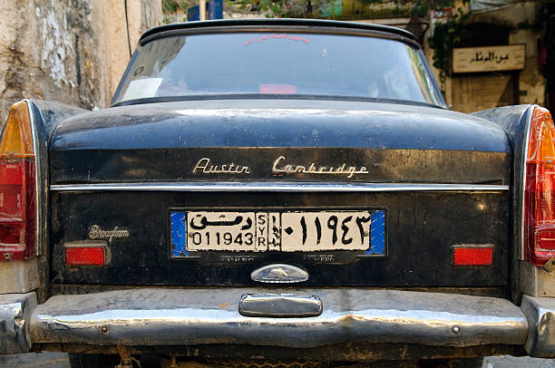 Damascus, Syria - June 16, 2010: Back side of an Austin Cambridge car with a Syrian license plate parked in the old city of Damascus. Austin Motor Company, based in Britain, manufactured Austin Cambridge cars from 1954 to 1969.