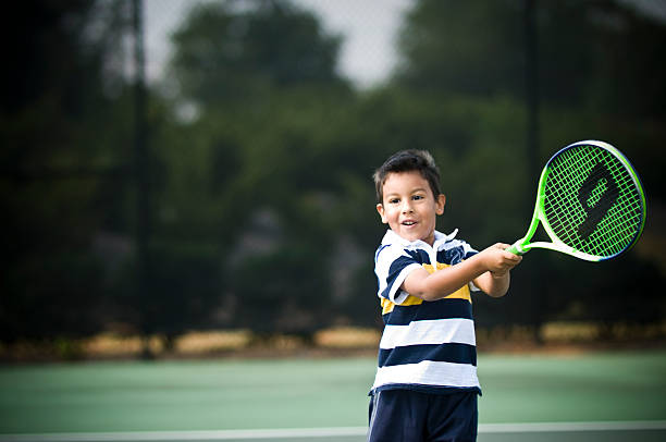 giovane giocatore di tennis swing - tennis child teenager childhood foto e immagini stock