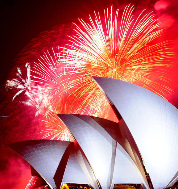 Sydney, New South Wales, Australia - December 31st 2008.  Fireworks burst over the Sydney Opera House on New Years Eve.
