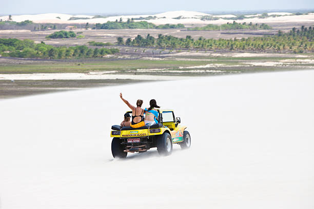 People in a buggie car during an excursion, Jericoacoara, Brazil stock photo