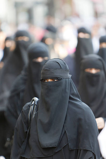 woman in burka stock photo