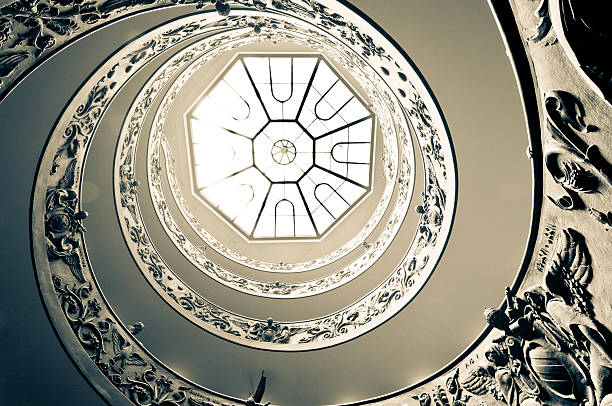 Rome, Italy - June 7, 2011: Overhead view of ornate spiral staircase at Vatican museum in Rome, Italy