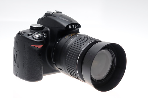 Kampen, The Netherlands - October 2, 2010: Nikon D5000 with lens isolated on a white background.