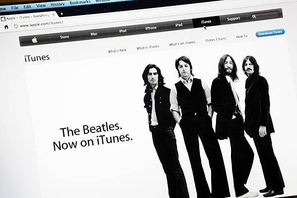 The Beatles on Itunes, Apple.com Website Rome, Italy - May 12, 2011: Screen shot of the Apple Computers website, with the music band of the Beatles. The songs of the music band are now on sale on iTunes. iTunes is a proprietary digital media player application, used for playing and organizing digital music and video files. beatles stock pictures, royalty-free photos & images