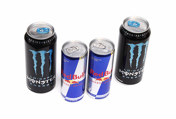 Red Bull and Monster Energy Drinks West Palm Beach, USA - November 28, 2011: Red Bull and Monster Energy Drinks. These energy drinks are caffeinated beverages enhanced with vitamins and other supplements, such as taurine and ginseng. They claim to vitalize the mind and body. monster energy stock pictures, royalty-free photos & images