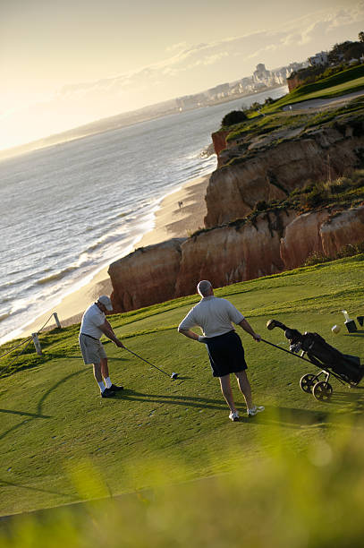 Vale De Lobo, Algarve, Portugal - April 3, 2010:  Golfers teeing off on the 7th hole at the coastal Vale De Lobo Golf Course.