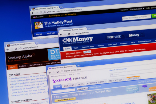 Warsaw, Poland - September 13, 2011: Photo of computer monitor with four browsers open.The Motley Fool, CNN Money, Seeking Alpha and Yahoo Finance. The Motley Fool is a multimedia financial-services company that provides financial solutions for investors through various stock, investing, CNNMoney.com is the world's largest business website. Seeking Alpha is a stock market blog that provides free stock market analysis. Yahoo! Finance is a service from Yahoo! that provides financial information. It is the top financial news and research website in the United States.