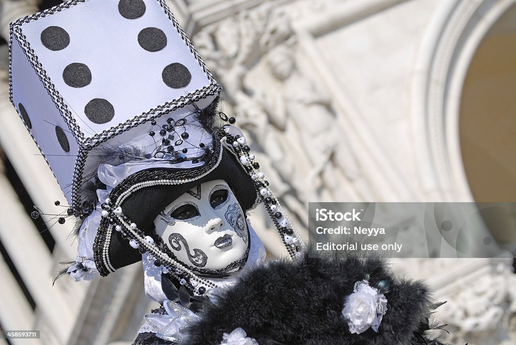 Venice Carnival 2009 "Venice, Italy - February 19, 2010 : One of the most attractive Venice mask, The person on this image wearing black and white traditional carnival costume with big game cube on the hat. The photo was taken during famous Venice carnival in Italy, Europe." Arch - Architectural Feature Stock Photo