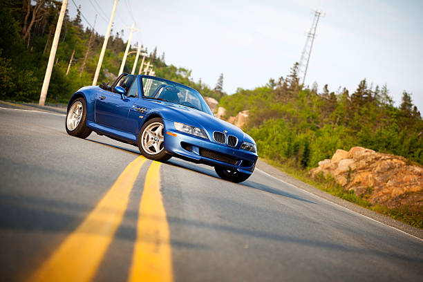 Timberlea, Nova Scotia, Canada - June 17, 2011: BMW M Roadster.  The 2000 BMW M Roadster on a long stretch of empty road. The BMW M Roadster is the high performance version of the popular Z3. The M Roadster was first produced for the 1998 model year and ended with the 2002 model year.