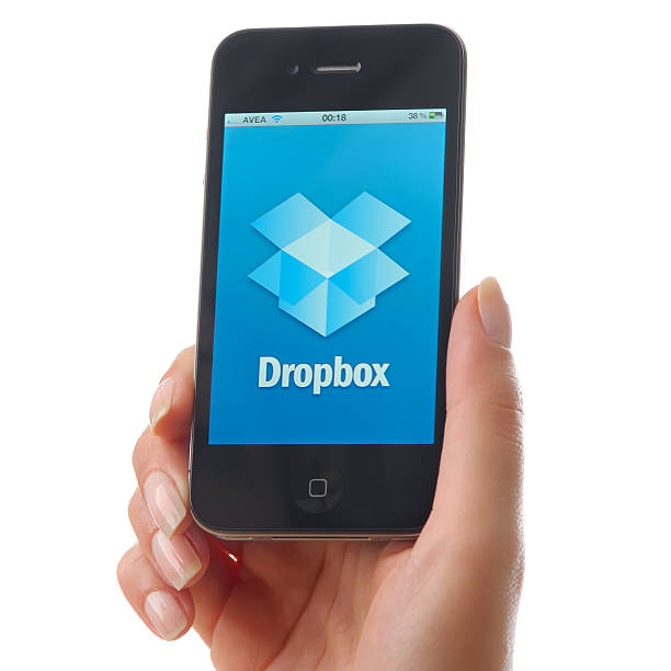 dropbox na iphone 4 - apple com zdjęcia i obrazy z banku zdjęć
