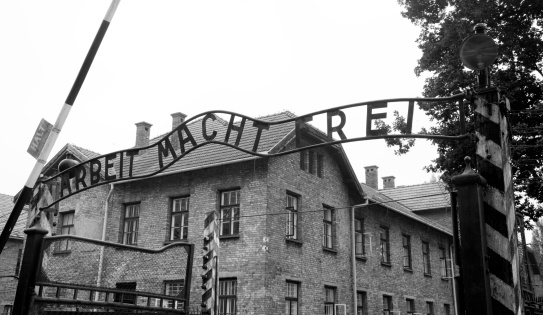 Auschwitz, Poland - July 2, 2009: The Auschwitz I concentration camp about six months before the sign at the entrance was stolen in December 2009 and then recovered by authorities in three separate pieces. It show the entrance to the concentration camp with the sign \