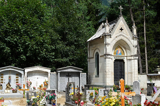 Luarca, Spain - September 24, 2016: Detail of the cemetery with graves and atuficial floweres in Luarca, Spain on an overcast day.