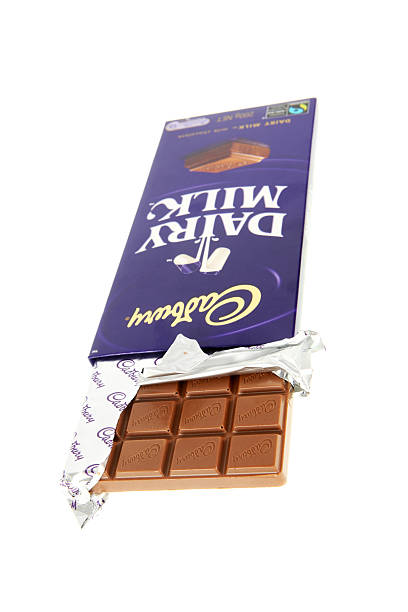 Cadbury Dairy Milk Chocolate Brisbane, Australia - 1 April, 2011: A 200g block of Cadbury Dairy Milk Chocolate that has been opened to show the chocolate inside. cadbury plc photos stock pictures, royalty-free photos & images