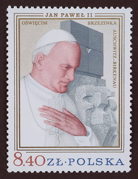 Postage Stamp, Pope John Paul II, portrait Ogrodzieniec, Poland - February 22, 2012: Photo Study of a postage stamp commemorating the visit of Pope John Paul II in Poland. The stamp shows the painted portrait of the Pope and a memorial to the victims of Nazi Concentration Camp at Auschwitz pope john paul ii stock pictures, royalty-free photos & images