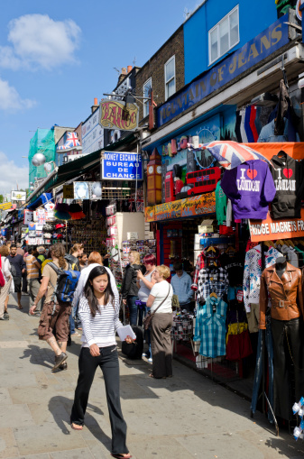 London, United Kingdom - July 24, 2011: Camden Street in London. Shoppers on the busy streets of Camden Town. Camden High Street and the nearby markets are one of London's most popular visitor attractions, attracting approximately 100,000 people every weekend. The area is famous for it's alternative culture shops.