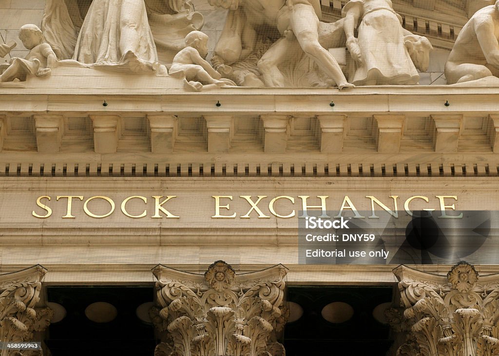 New York Stock Exchange New York, New York, USA - July, 25, 2006: A close up detail of the words Stock Exchange from the facade of the New York Stock Exchange building located on Wall St. in Lower Manhattan. Building Exterior Stock Photo