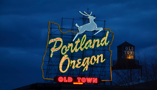 Portland, OR USA - March 23, 2011: Originally called the White Stag sign, the Portland Oregon sign sits atop the White Stag Building in Old Town district downtown Portland, Oregon. The sign has gone through several different wording arrangements since its installation in 1940.