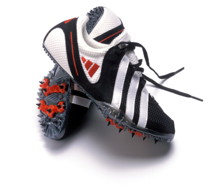 Leiden, The Netherlands - November 14, 2003: Product shot of a pair of Adidas golf shoes on white background. Adidas is a German sportswear manufacturer, the largest in Europe and the second biggest worldwide.