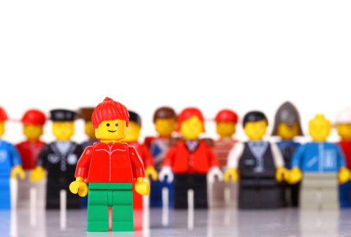 London, United Kingdom- September 22, 2011: A group of lego mini figures  on white background. The lego figure is a small plastic toy available through the Danish toy manufacturer the Lego Group. They were first produced in 1978
