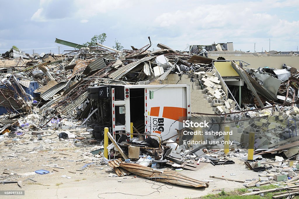 Big Lots store destroyed by tornado Tuscaloosa, Alabama, USA - July 17, 2011:  Loading dock of Big Lots store destroyed by April 27, 2011 tornado.  Image taken near back of store showing overturned truck buried by building debris. Tornado Stock Photo