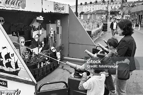 Children Playing Games On Seaside Pier Stock Photo - Download Image Now - Adult, Aiming, Amusement Arcade